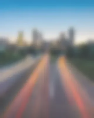 A blurred city view at the end of a road